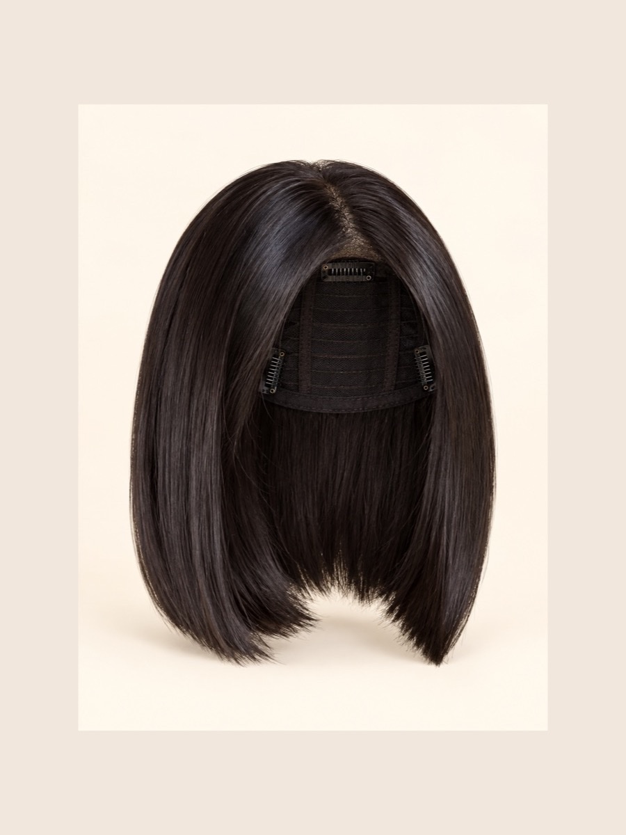 C11 hair topper displayed on a warm cream background