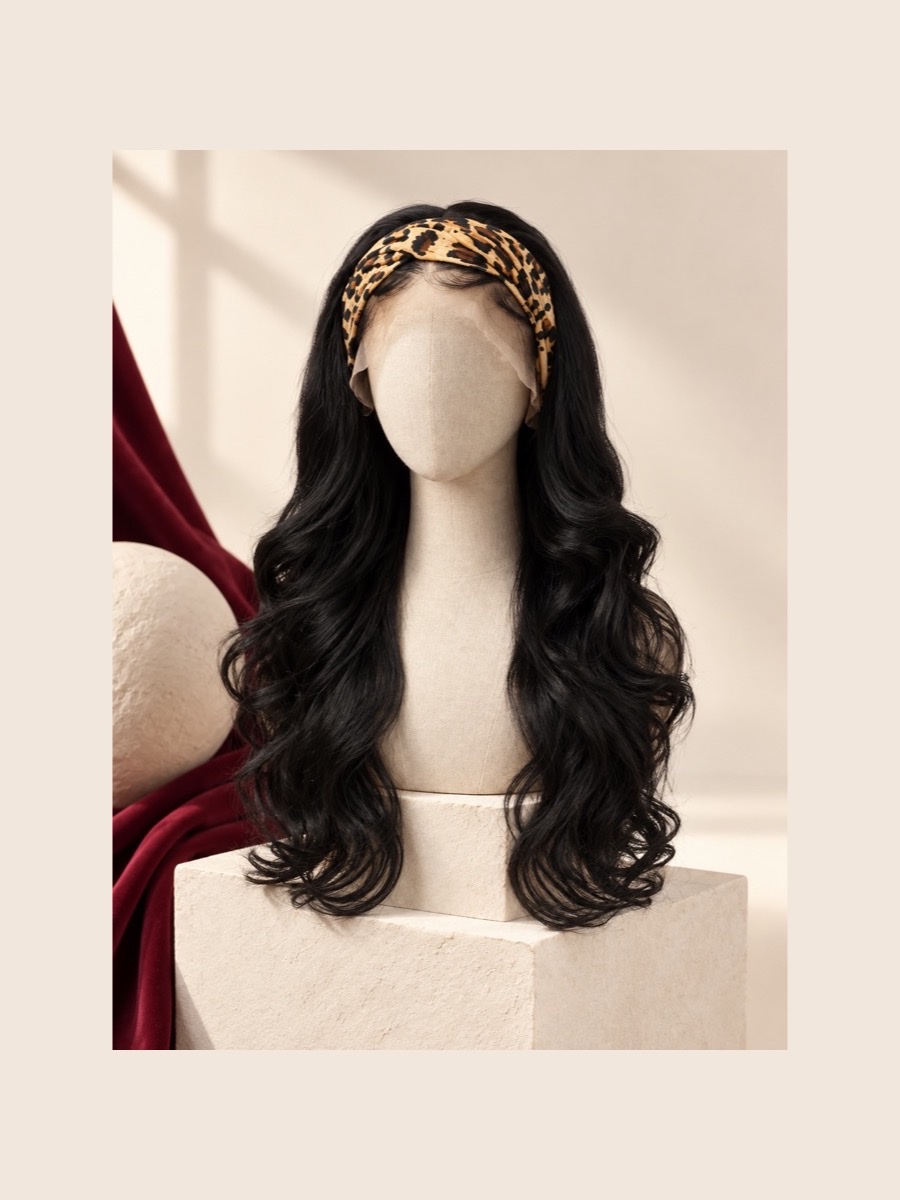 Long black headband half wig displayed on a faceless linen mannequin